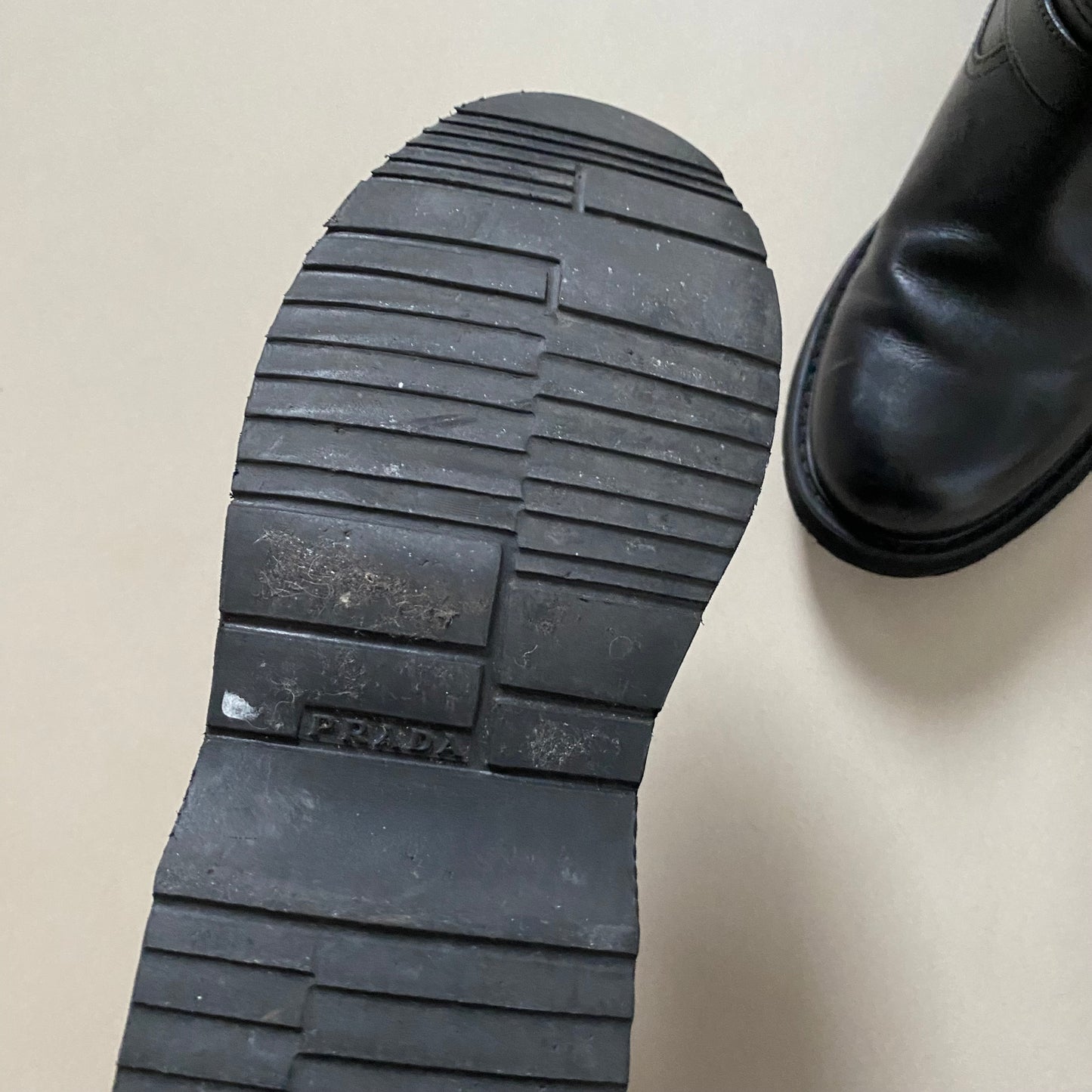 Prada black leather buckle boots