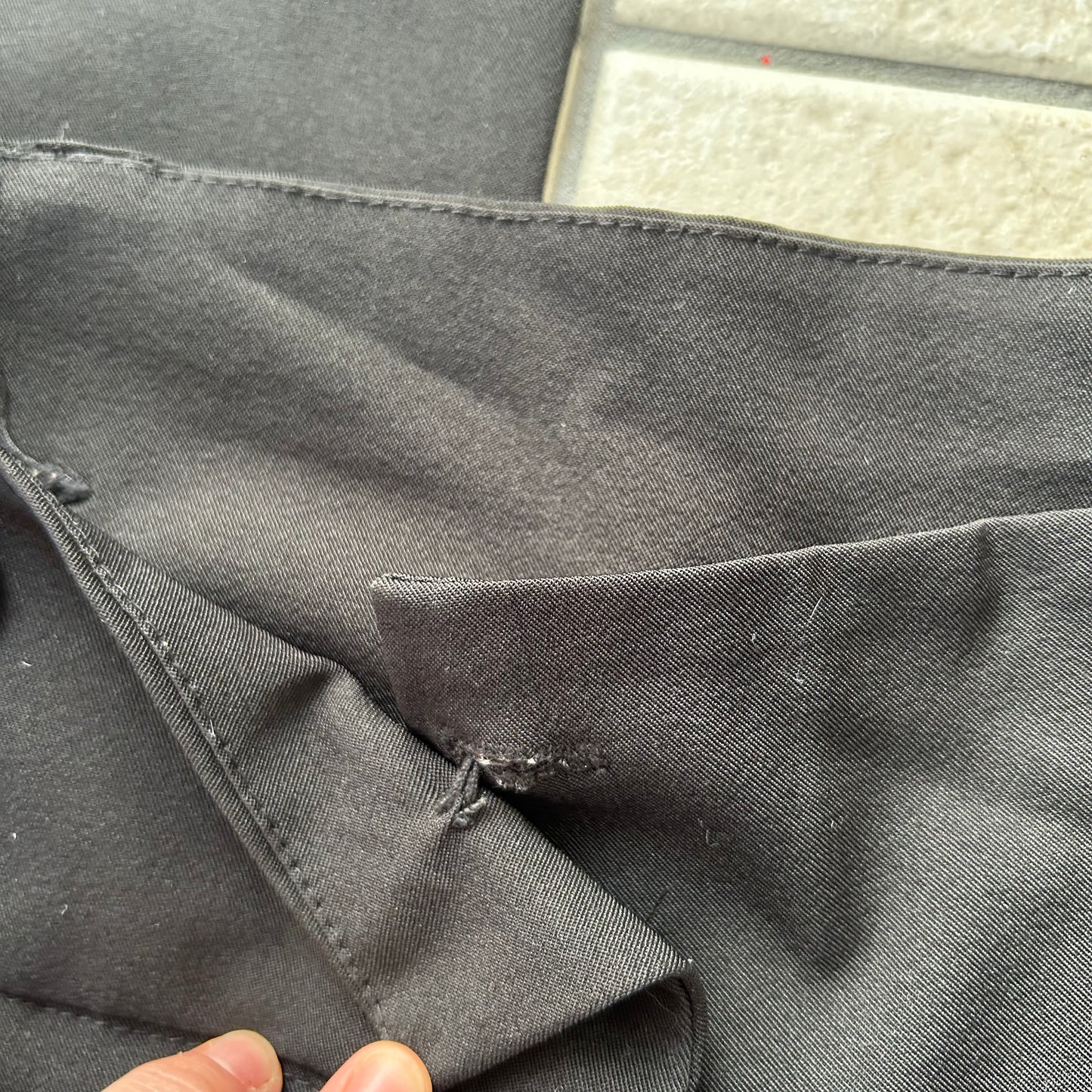 Black stetch button up trousers